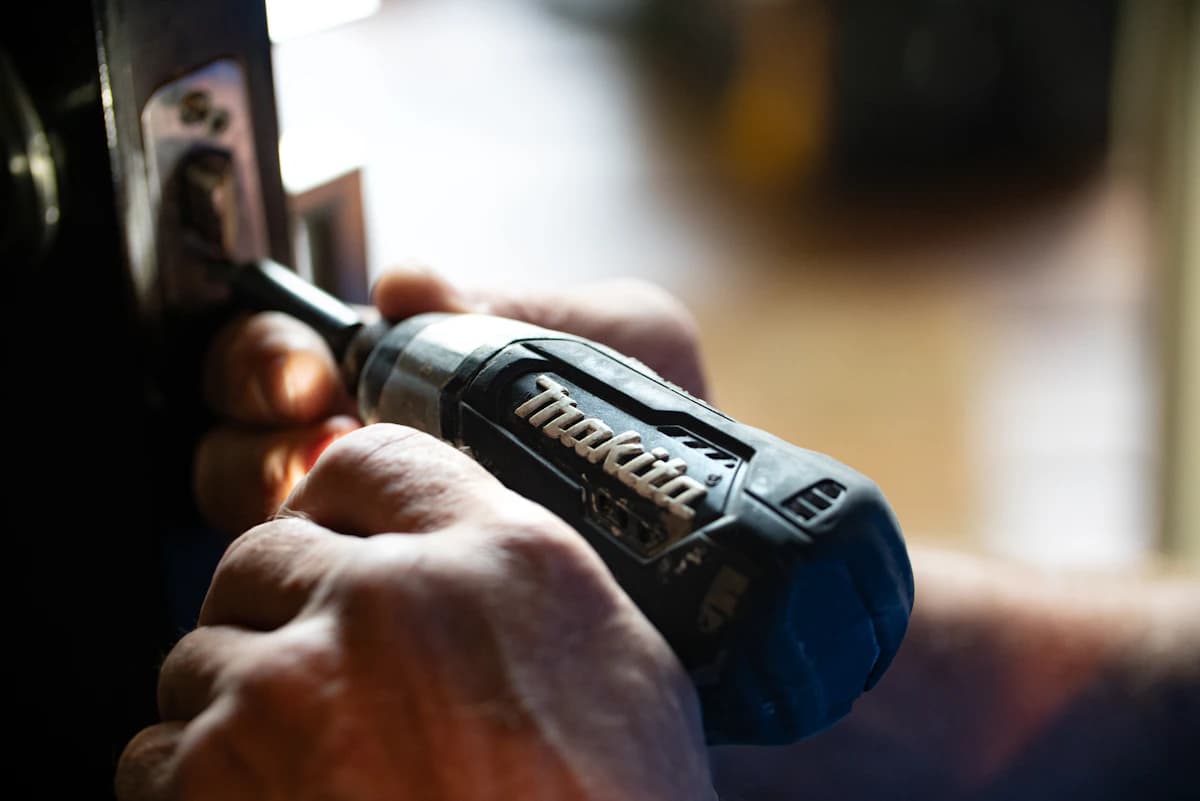 Painter rolling a fresh coat on an interior wall